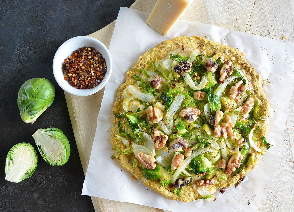 Herbed Chickpea Pizza with Brussels Sprouts, Caramelized Onion, and Walnuts